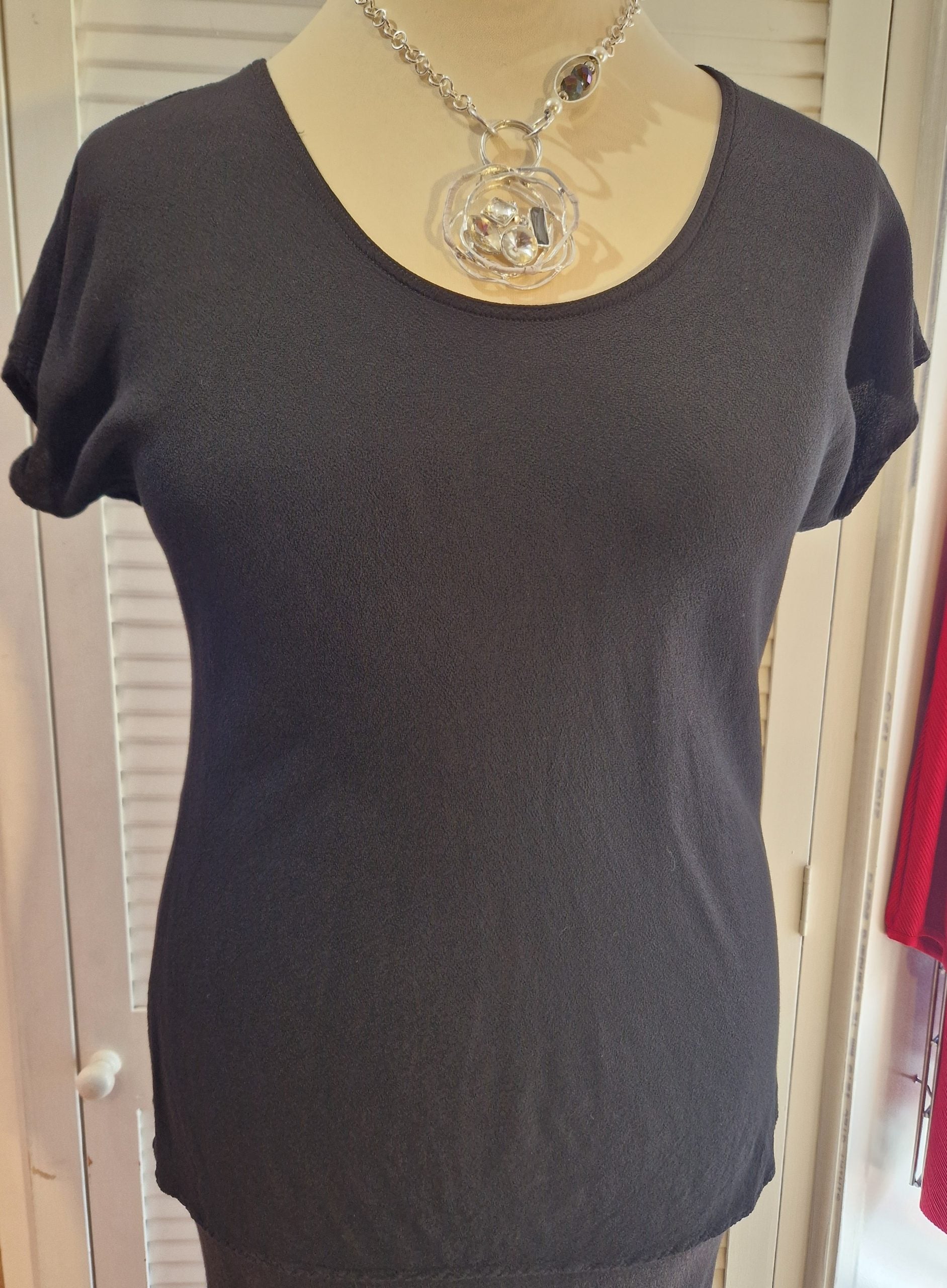 Our mannequin is wearing Belladonna bias cut top in black for Froxx Clothing