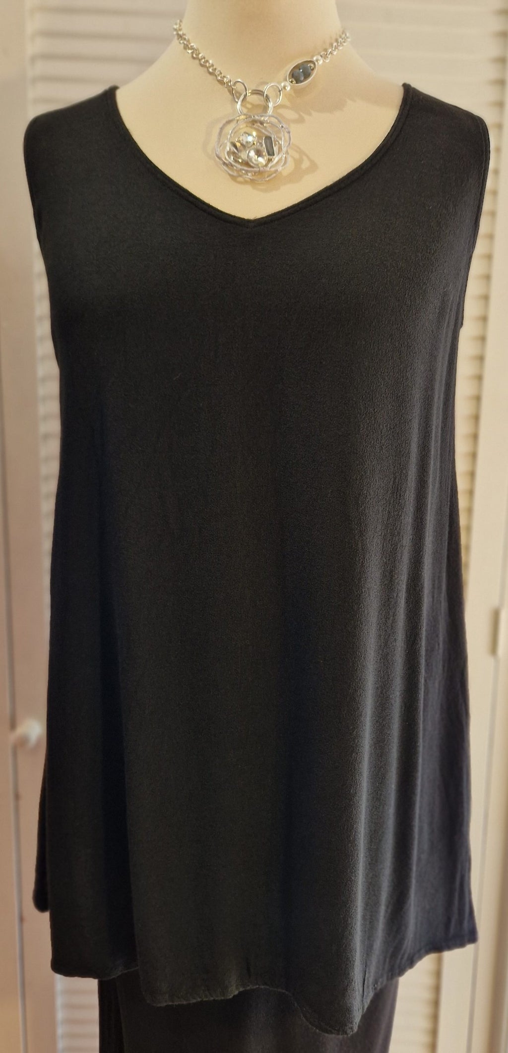 Our mannequin is modelling Belladonna crepe v neck vest in black for Froxx Clothing