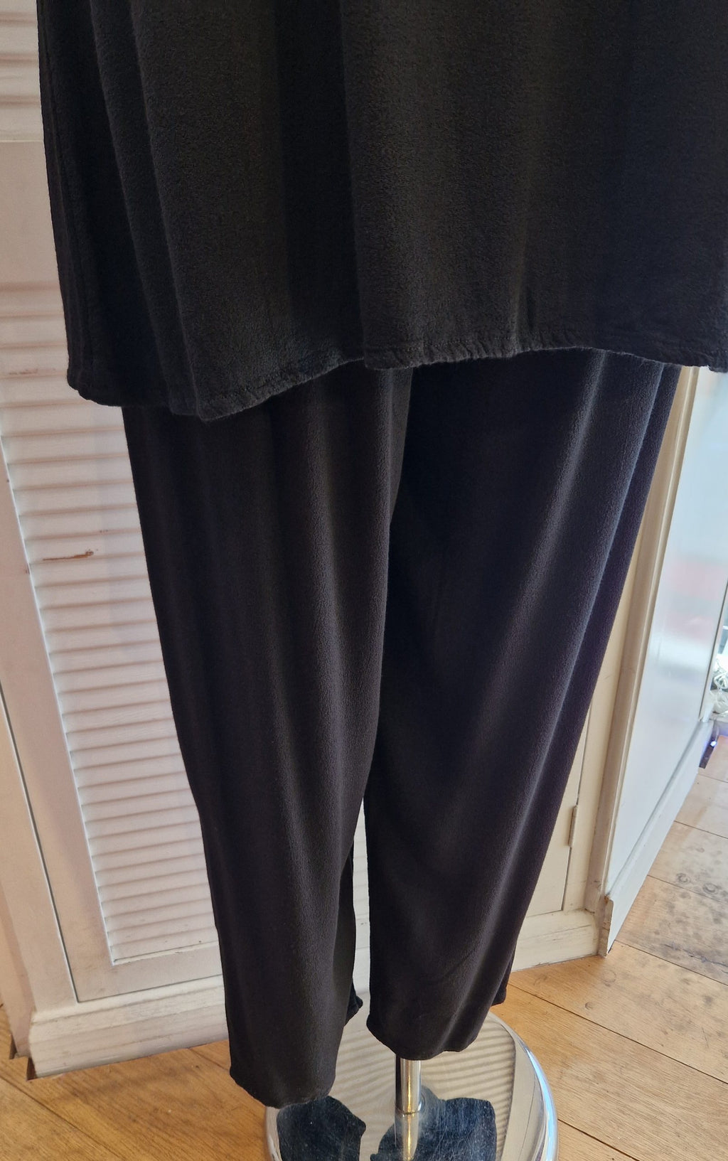 Our mannequin is modelling Belladonna crepe trousers in black for Froxx Clothing