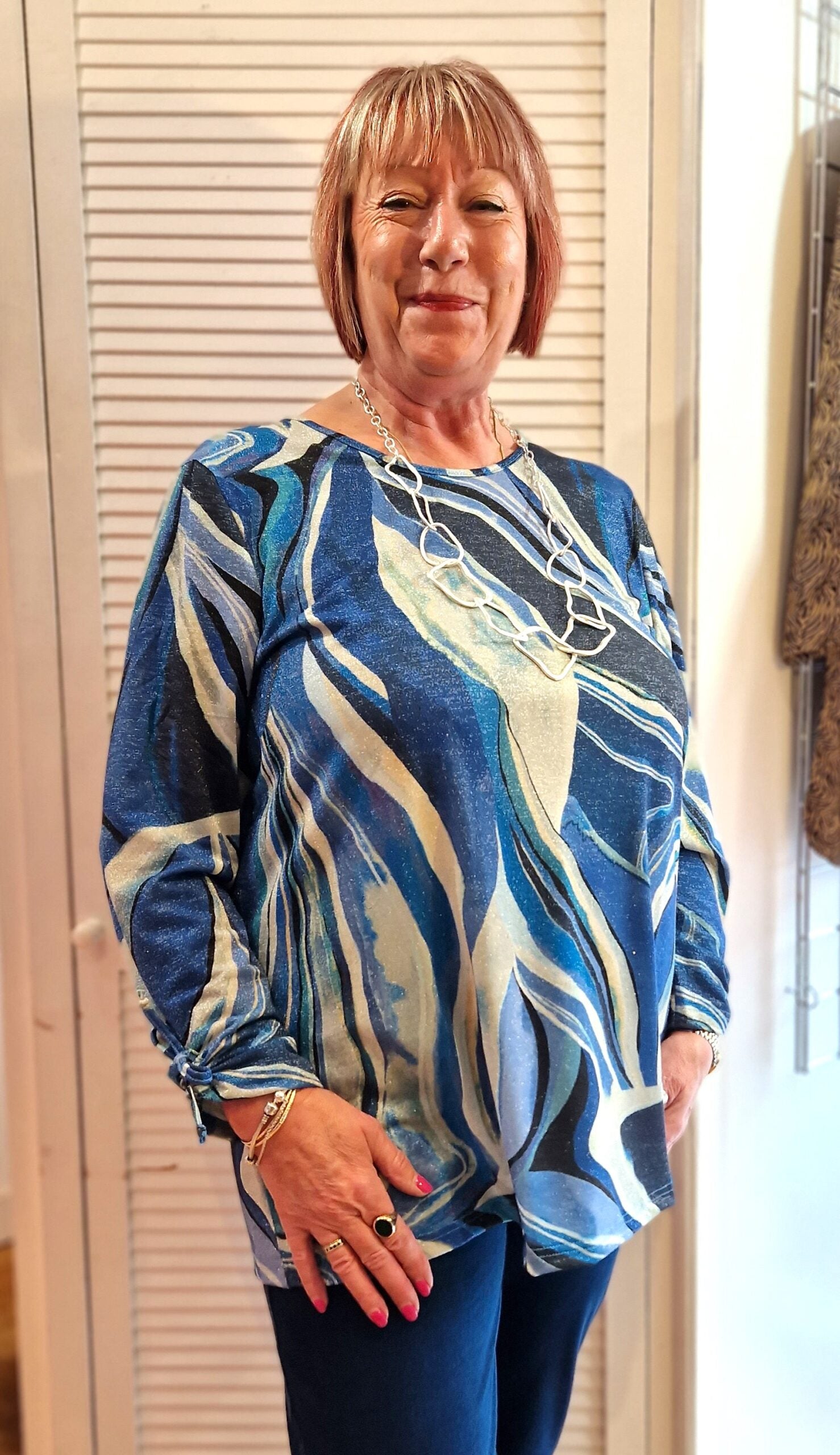 Model is wearing See You lurex top in blue for Froxx Clothing plus sizes