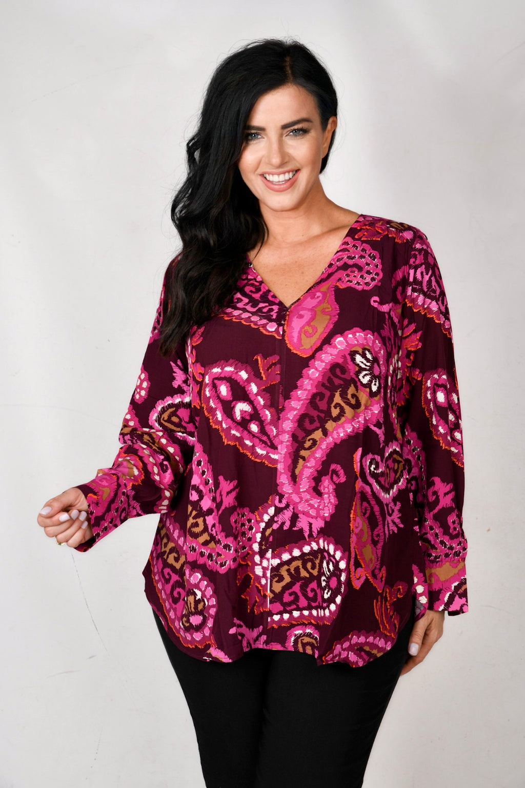 model is wearing Via Appia Paisley top in pinks for Froxx Clothing plus sizes