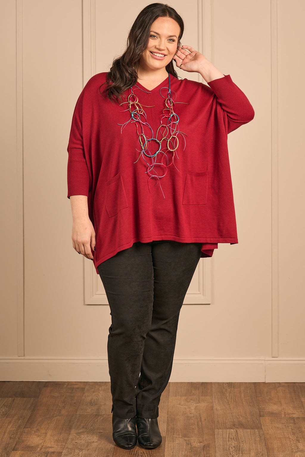 Our model is wearing Thanny batwing jumper in red for Froxx clothing plus sizes