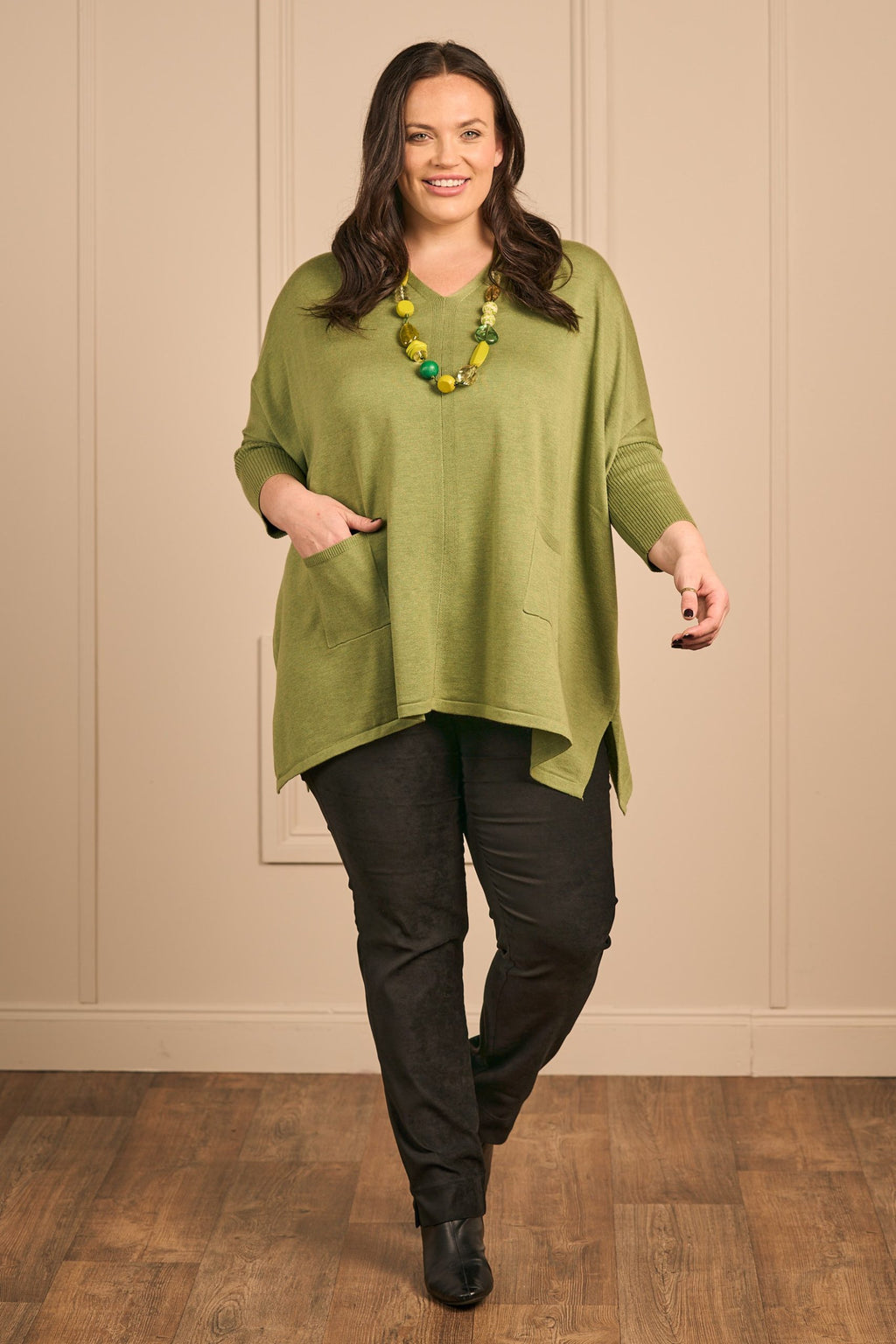 Our model Zhana Paton is wearing Thanny batwing jumper in lime for plus size specialists Froxx Clothing