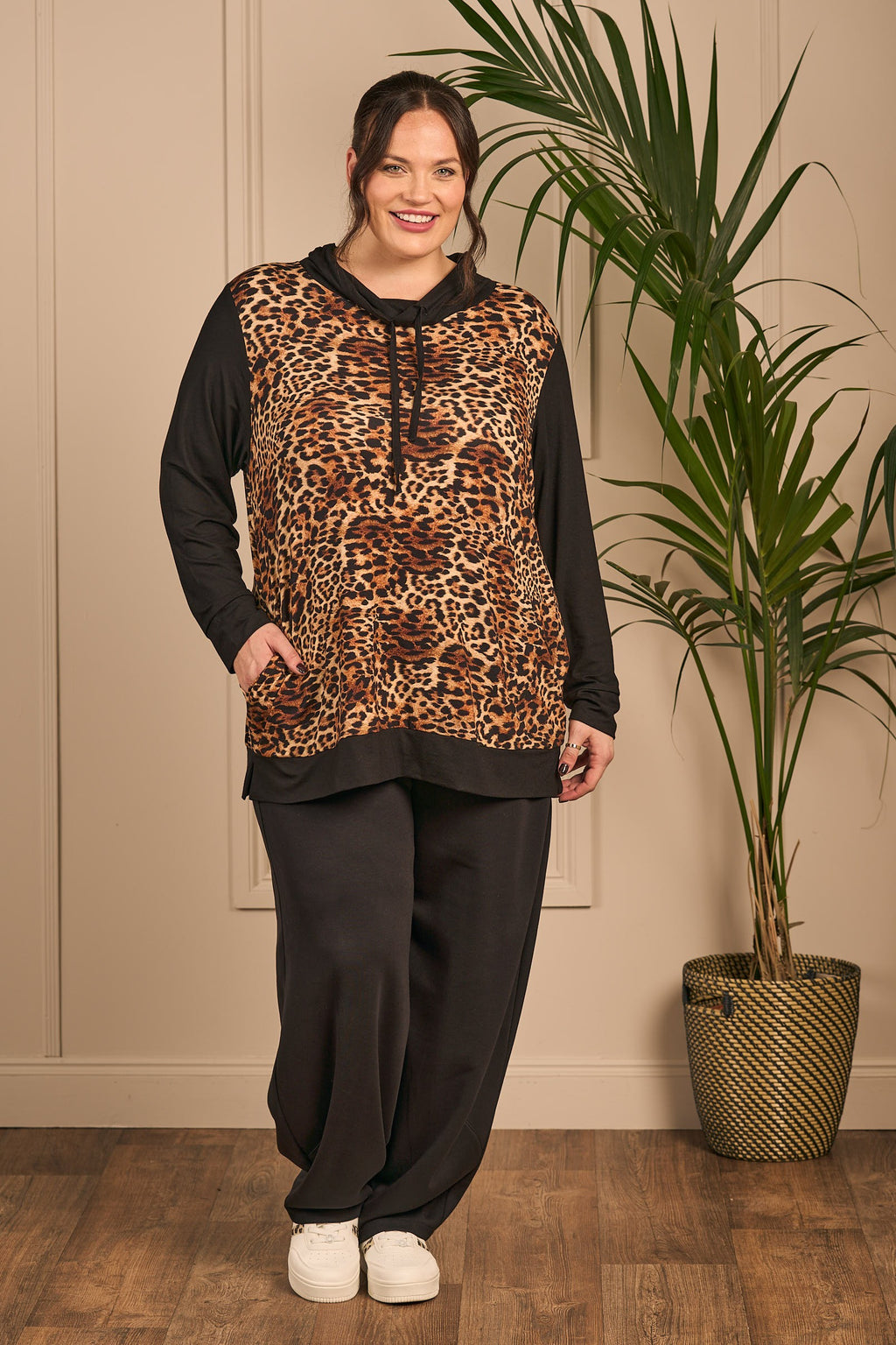 Our model is wearing KJ Brand jersey leopard block top in black and animal print for Froxx Clothing plus sizes