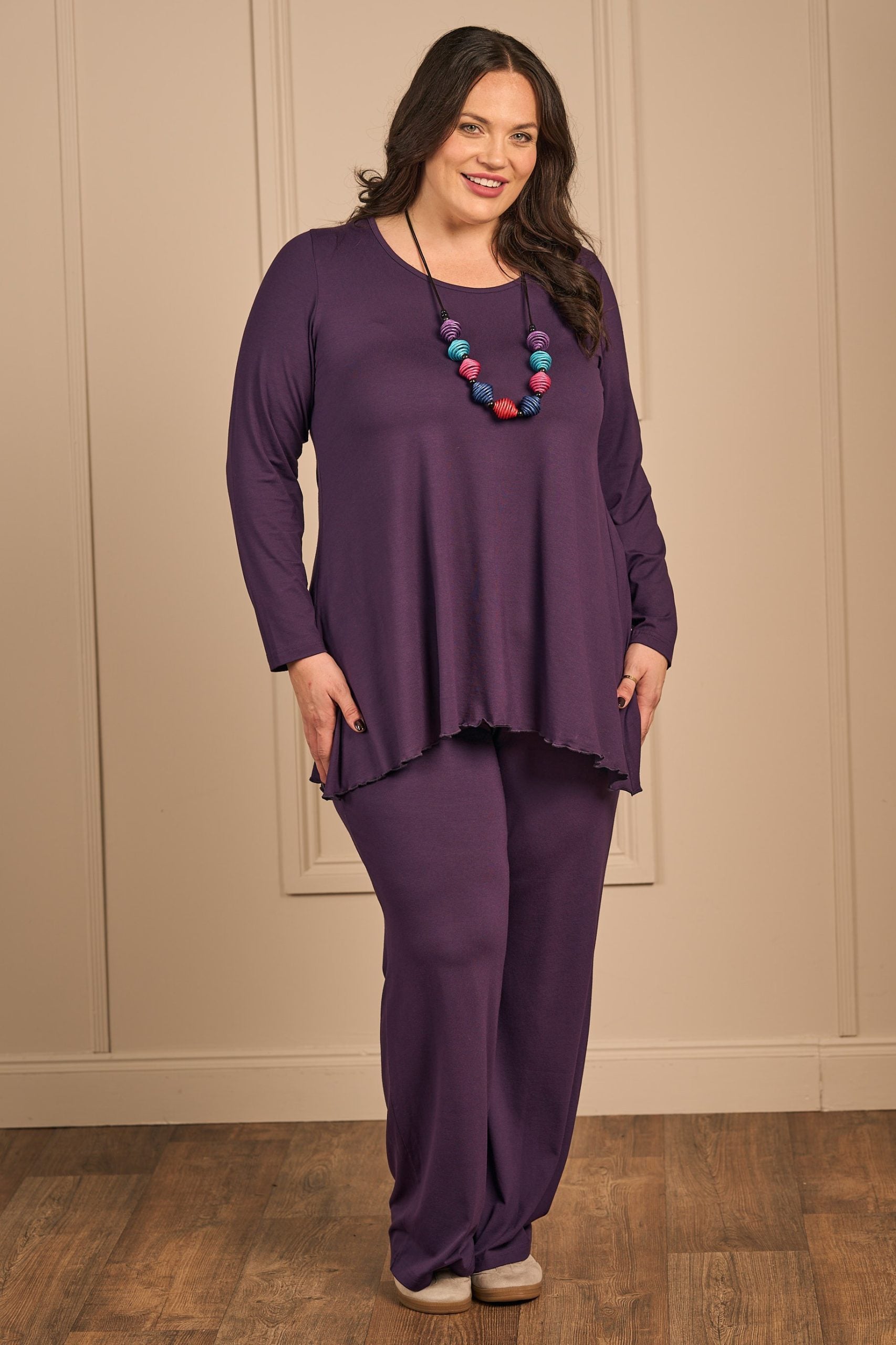 Our model is wearing Exelle Saskatol jersey tee in purple for plus size specialists Froxx Clothing