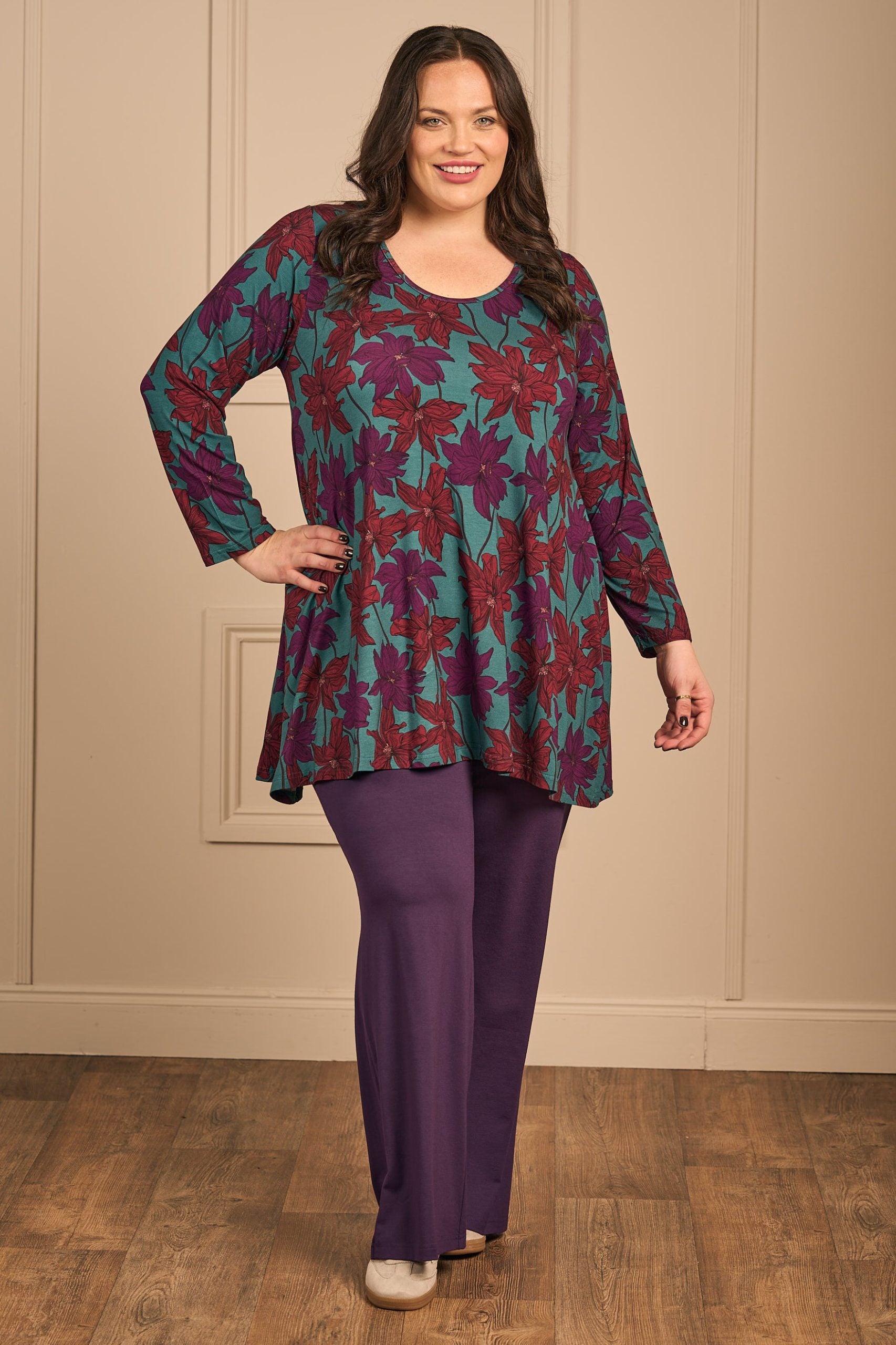 Our model is wearing Exelle Trozoni jersey tunic in magenta for Froxx Clothing plus sizes