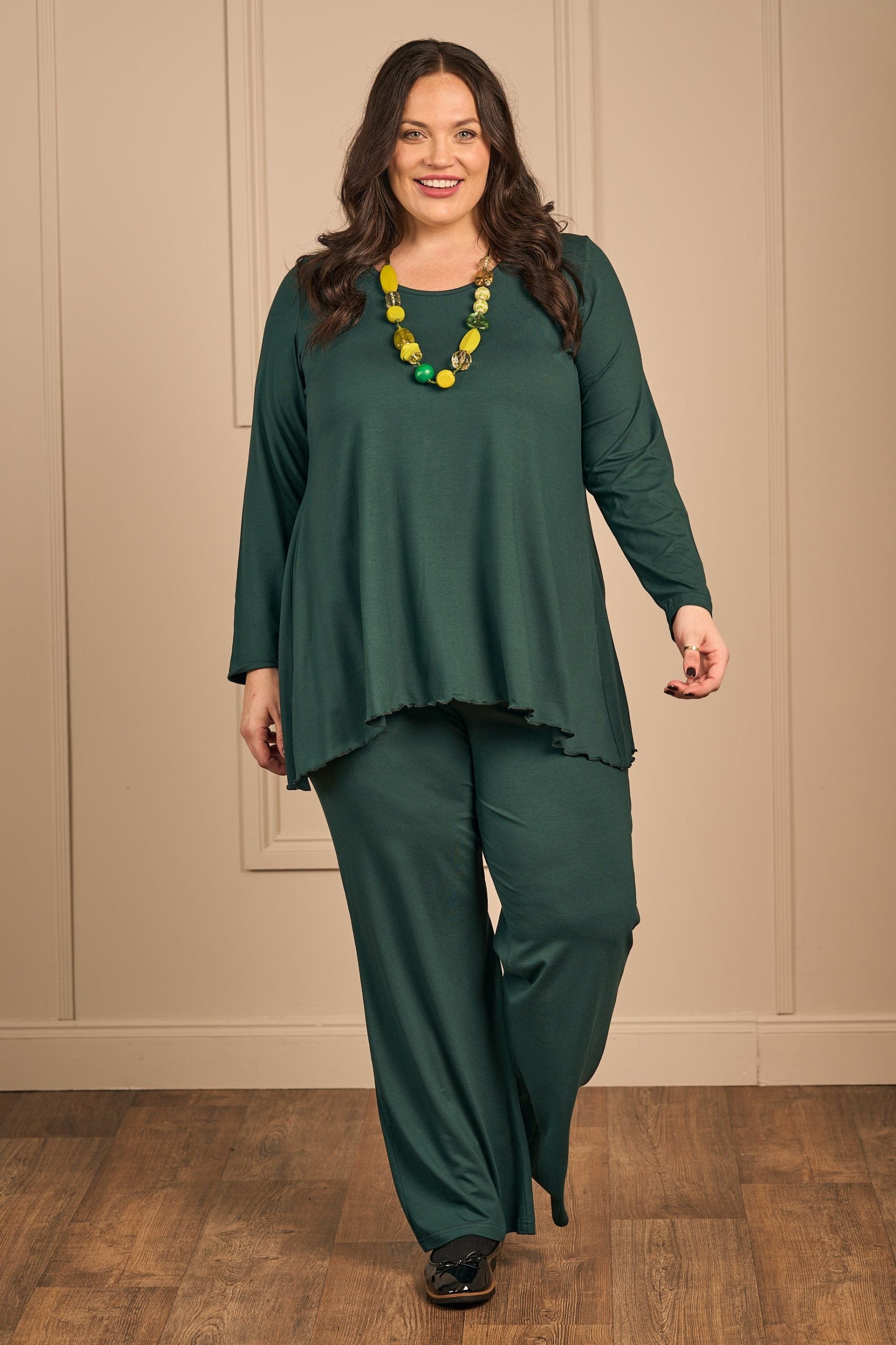 OUr model is wearing Exelle Saskatol jersey tee in forest green for Froxx Clothing plus sizes