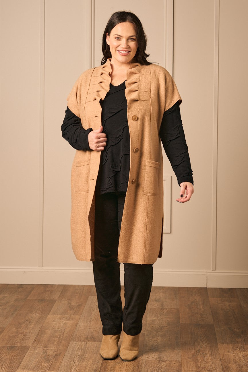 Our model is wearing Noen boiled wool gilet in camel for Froxx Clothing plus sizes