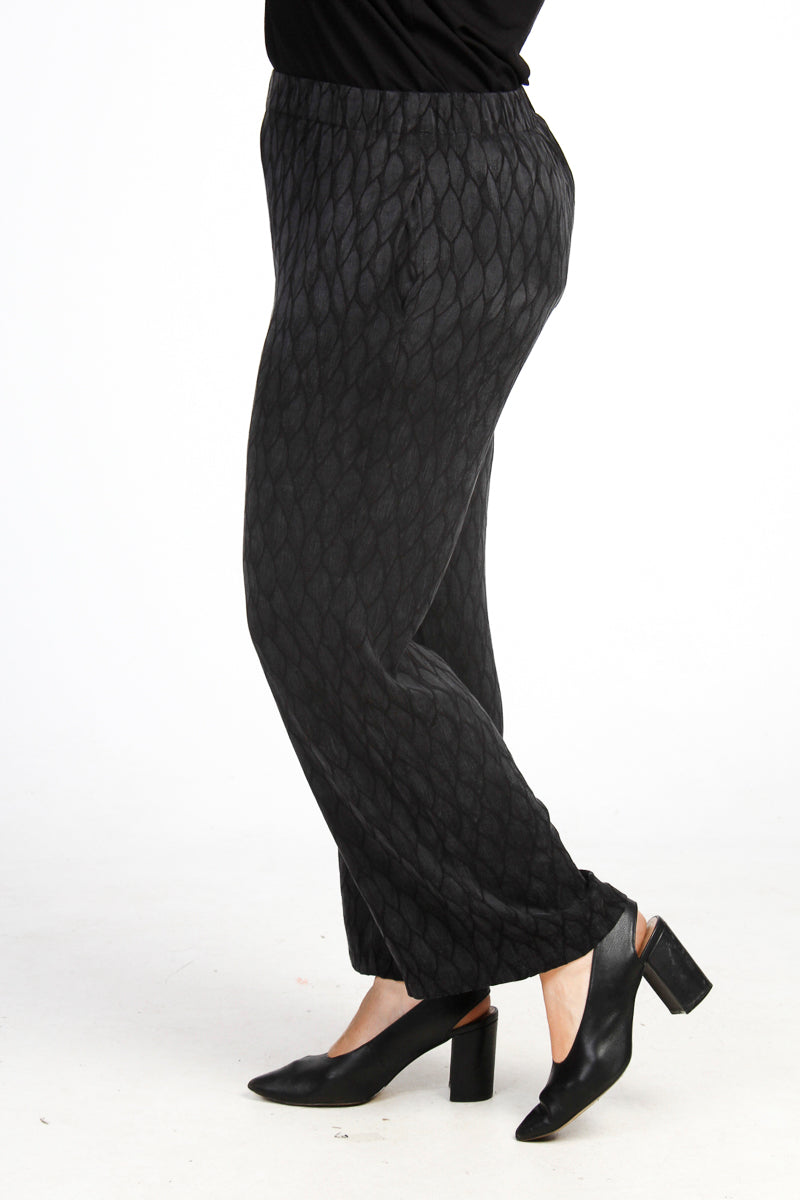 Our model is wearing Mona Lisa leaf print short palazzos in black for Froxx Clothing