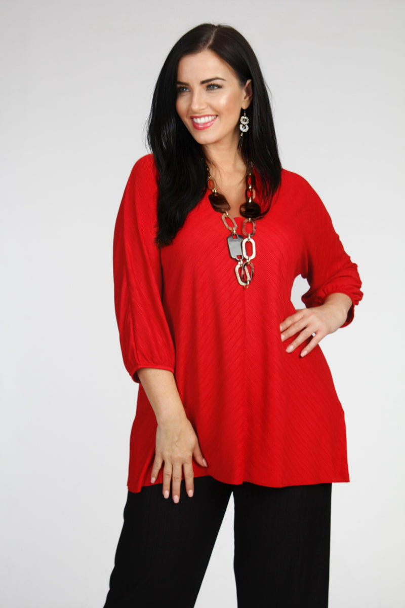 Our model is wearing See You by Biggi M plissee V neck top in red for Froxx Clothing