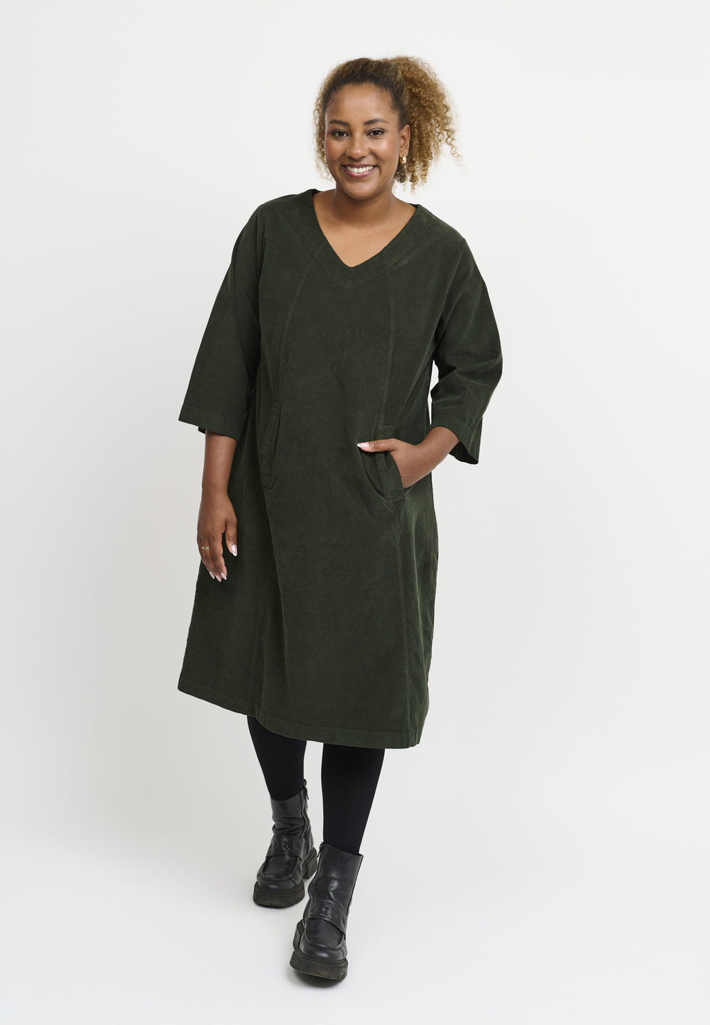 Our model is wearing Pont Neuf Ulrica corduroy dress in forest green for Froxx Clothing plus sizes