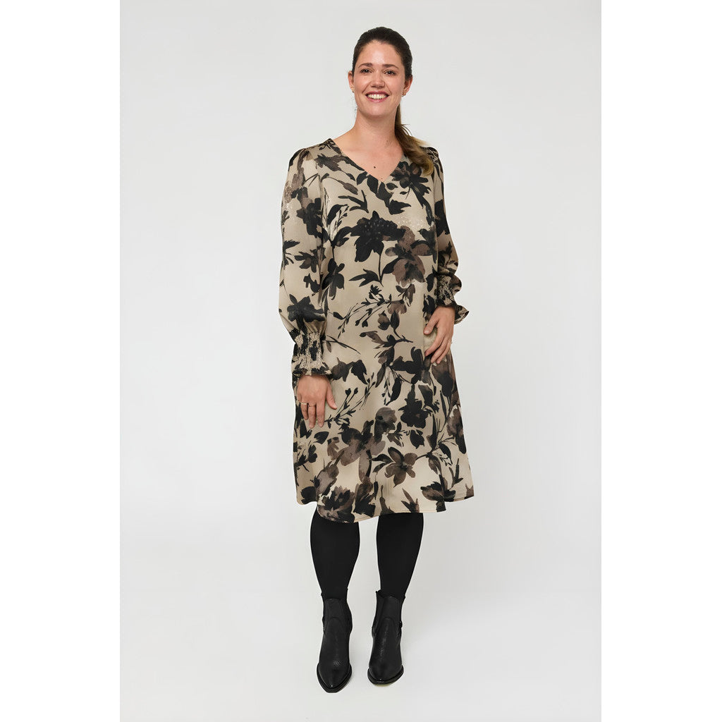 Our model is wearing Pont Neuf Viva dress in stone for Froxx Clothing plus sizes